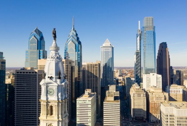 Statue of Ben Franklin looks over the city streets of Philadelphia PA